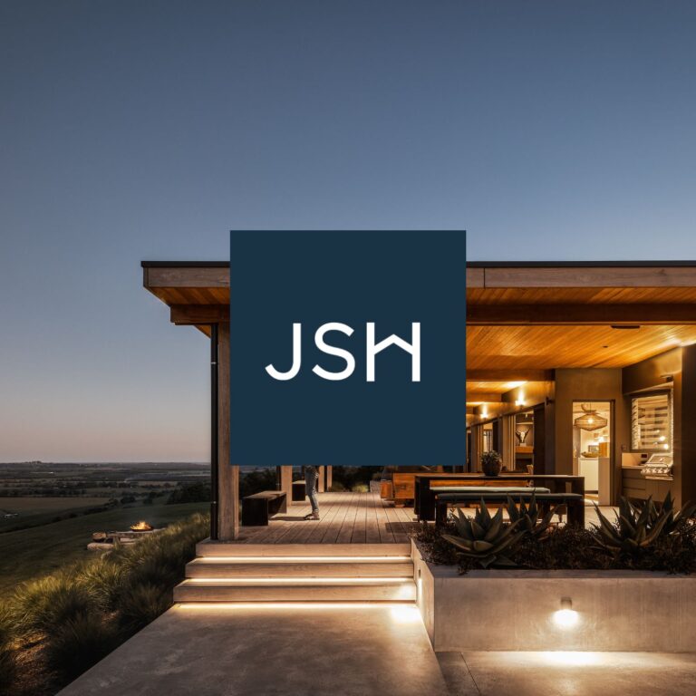 J S Henderson Builders logo over a modern home at dusk, website by Inversit