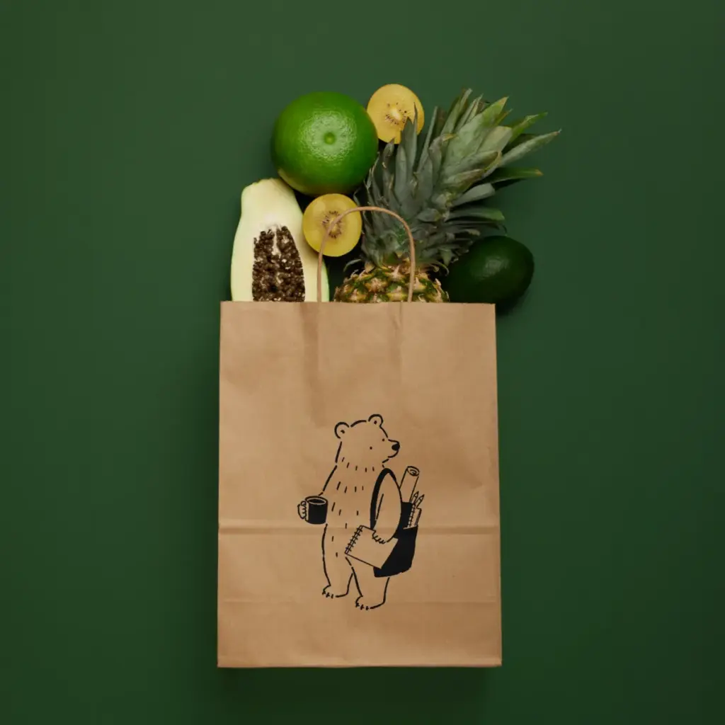 Illustrated bear on a kraft paper shopping bag, brand design by Inversit