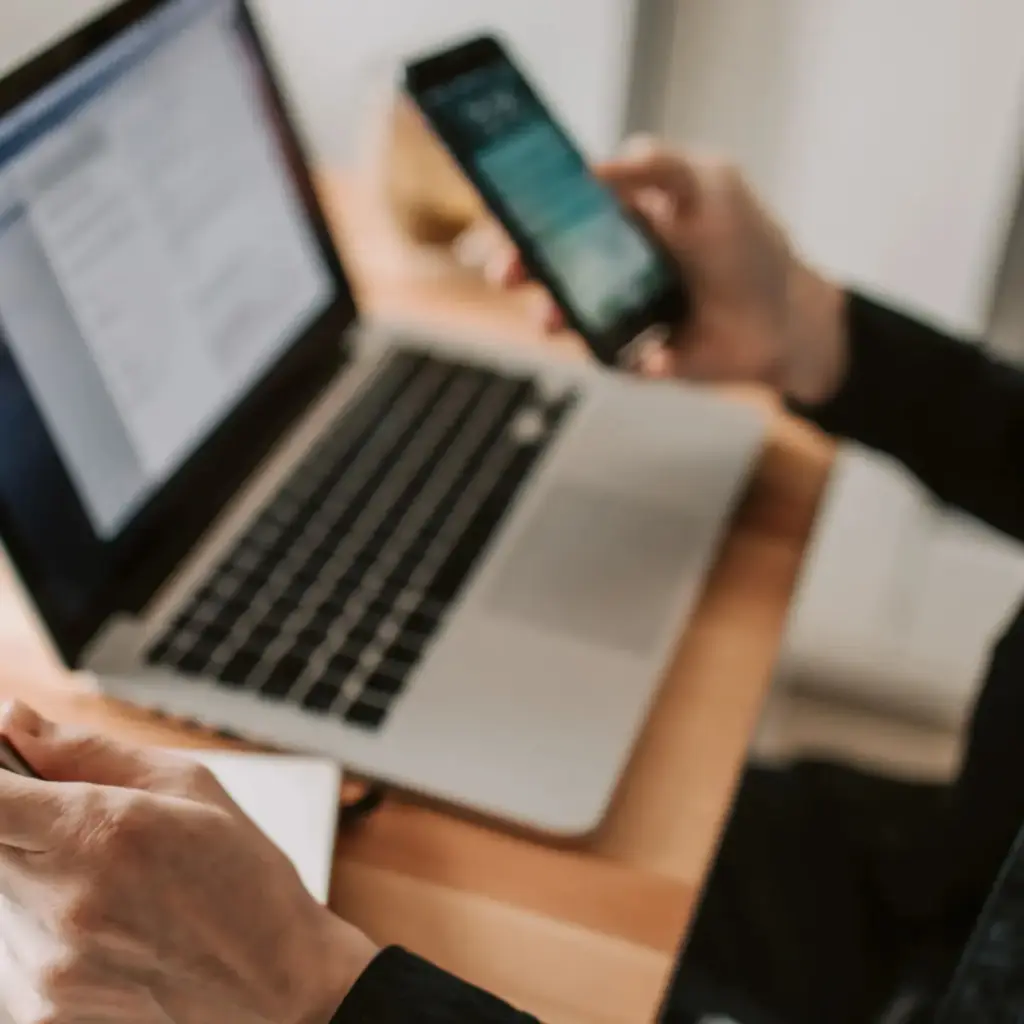 Laptop and smartphone in use, IT consulting by Inversit