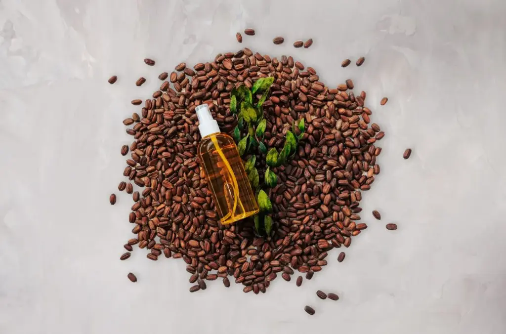 Jojoba Australia oil bottle on jojoba seeds, website by Inversit